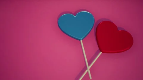 Two lollipops. Blue and Red hearts. Candy. Love concept. Stock Footage 133330557