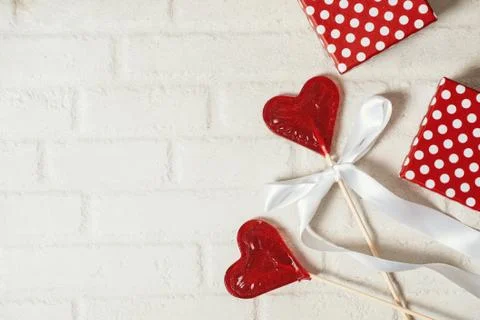 Two lollipops. Red hearts. Candy. Love concept. Valentine day. Stock Photos