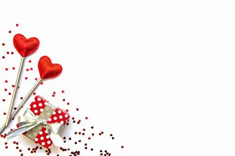 Two love magic wands and a gift. Valentine's Day concept. Copy space. Stock Photos
