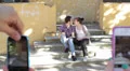 two lovers are taking pictures from friends - cell phone - kiss - photo HD Footage