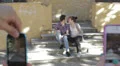 two lovers are taking pictures from friends - cell phone - kiss - photo HD Footage