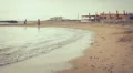 two lovers chase (run after) and kissing in the sea - beach - love - sunset HD Footage