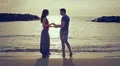 two lovers chase (run after) and kissing in the sea - beach - love - sunset HD Footage