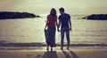 two lovers chase (run after) and kissing in the sea - beach - love - sunset HD Footage