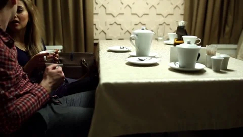 Two lovers drink tea in the restaurant Stock Footage 77521767