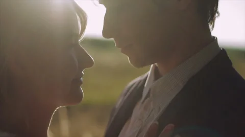Two Lovers at Sunset Enjoying an Intimate Moment. Laughing Stock Footage 62352363