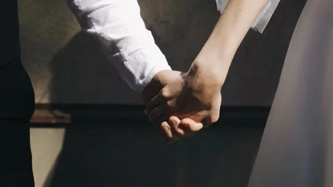 Two lovers tenderly hold hands. They hold their palms together Stock Footage 301210220