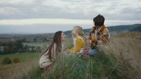 Two loving lesbians playing with pretty daughter in grass Stock Footage 197667340