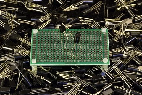 Two low-power silicon transistors in a plastic case do boxing or fencing on a Stock Photos