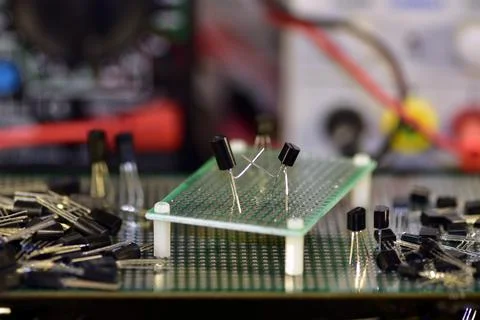 Two low-power silicon transistors in a plastic case do boxing or fencing on a Stock Photos