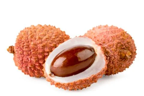 Two lychee and half close up on a white. Isolated. Fotos Stock