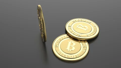Two lying and one rotating golden bitcoins. Stock Footage 86581534