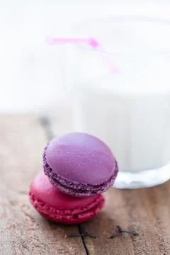 Two macaroons and milk Stock Photos