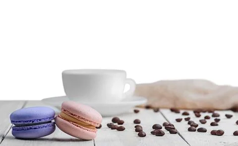 Two macaroons with cup coffee beans Stock Photos