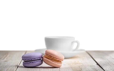 Two macaroons with a cup coffee Stock Photos
