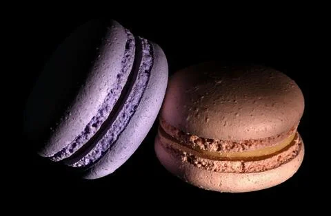 Two macaroons darkened in black Stock Photos