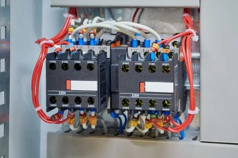 Two magnetic contactor connected in reverse starting Assembly. Stock Photos