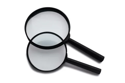 Two magnifying glasses on a white background. Stock Photos