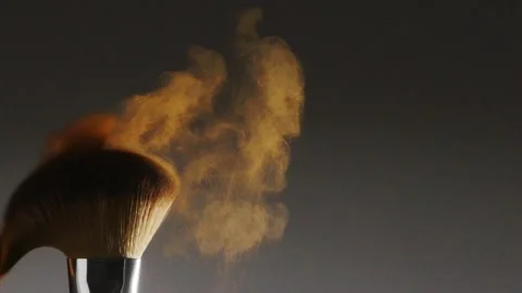 Two make-up brushes  creating an explosion of colored powder. Stock Footage 259040942