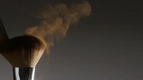 Two make-up brushes  creating an explosion of colored powder. Stock Footage 259040957