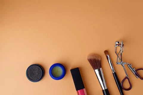 Two makeup brushes, brushes for blush, eyeshadow, eyeshadow, pink lipstick Stock Photos