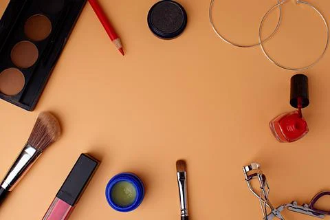 Two makeup brushes, brushes for blush, eyeshadow, pink lipstick, lip gloss Stock Photos