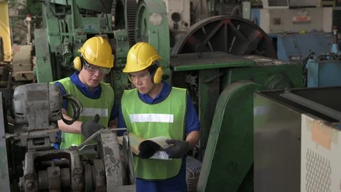 Two Male asian inspector, engineer working in the production line process in  Stock Footage 125559809