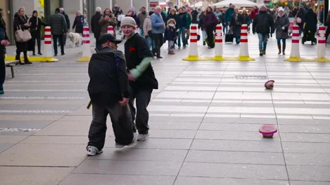 Two male breakdancers performing hip hop on a city street Stock Footage 332803738