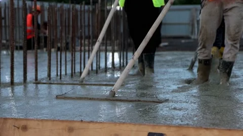 Two male builders are smoothing concrete Stock Footage 208564267