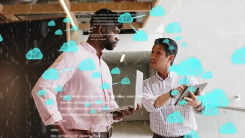 Two male colleagues pointing at tablet and demonstrating cloud computing with Stock Footage 333318326