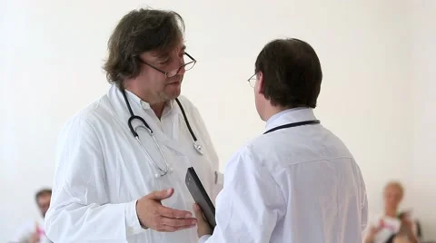 Two male doctors discussing Stock Footage 52133356