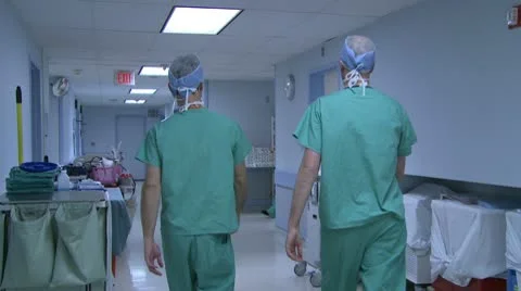 Two male doctors head to surgery Stock Footage 10713626