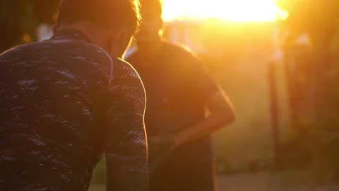 Two male friends practicing baseball Stock Footage 231561526
