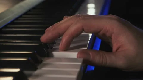 Two male hands playing the keys in close-up Stock Footage 156548799