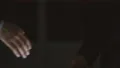 The two male handshake on the dark background. slow motion 4k or 4k+ Resolution
