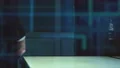 The two male handshake near a display on the hologram background. slow motion 4k or 4k+ Resolution