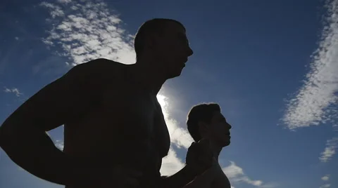 Two male jogger training for marathon run. Athletes exercising and running Stock Footage