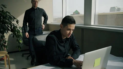 Two male managers working together in modern office. Video stock 89963419