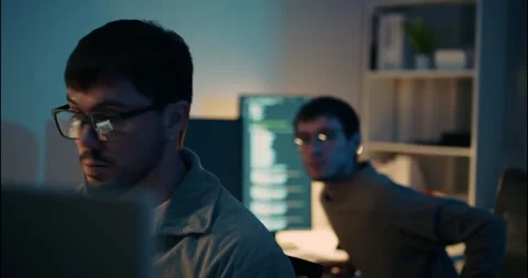 Two Male Programmers Focused on Coding in a Dark Home Office. Stock Footage 306739185