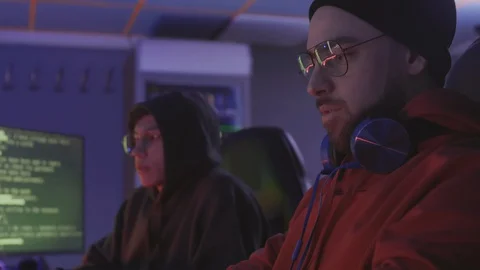 Two Male Programmers Working Together at Night Stock Footage 129813572