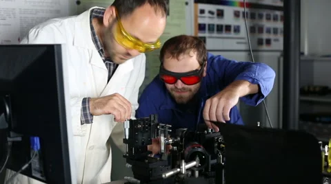 Two male scientists performing an experimental research Stock Footage 45324670