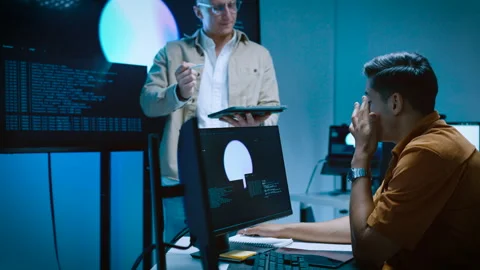 Two male software developers collaborating and explaining AI system archite.. Video stock 337094190