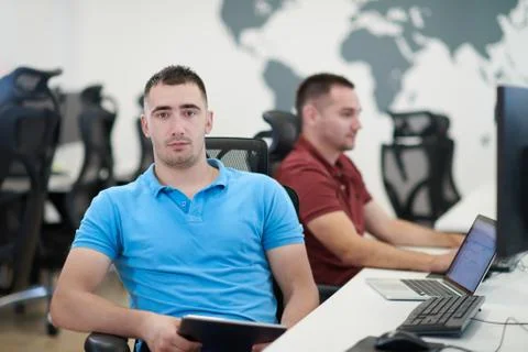 Two male software developers working on computer Stock Photos