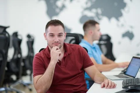 Two male software developers working on computer Stock Photos