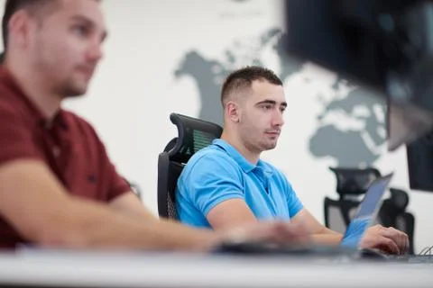 Two male software developers working on computer Stock Photos
