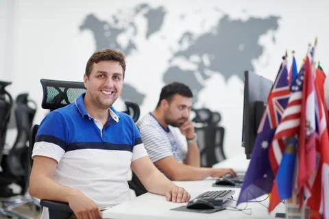 Two male software developers working on computer Stock Photos