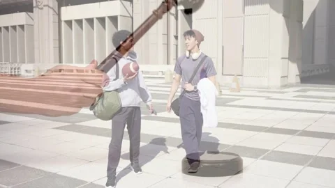 Two male students walking carrying football talking while legal gavel overlay Stock Footage 333774897