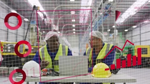 Two male techs leaning over laptop typing and causing globe and factory charts Stock Footage 334321928