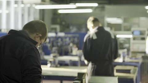 Two male workers in an industrial workshop 1 Stock Footage 151556557