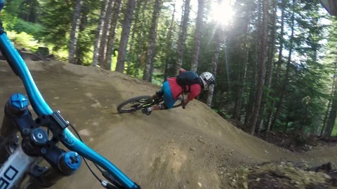 Two Males Mountain Biking Fast Through Forest  Video stock 102623696